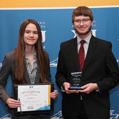 Student Holding Award