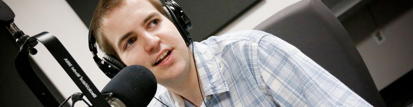 Student working at college radio station